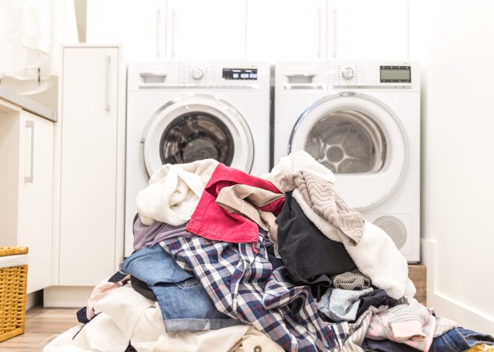 Laundry room with a pile of dirty clothes on floor